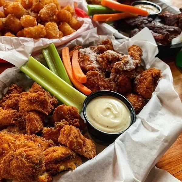 Chicken wings, tenders, tots, and dipping sauces from the existing photo collection